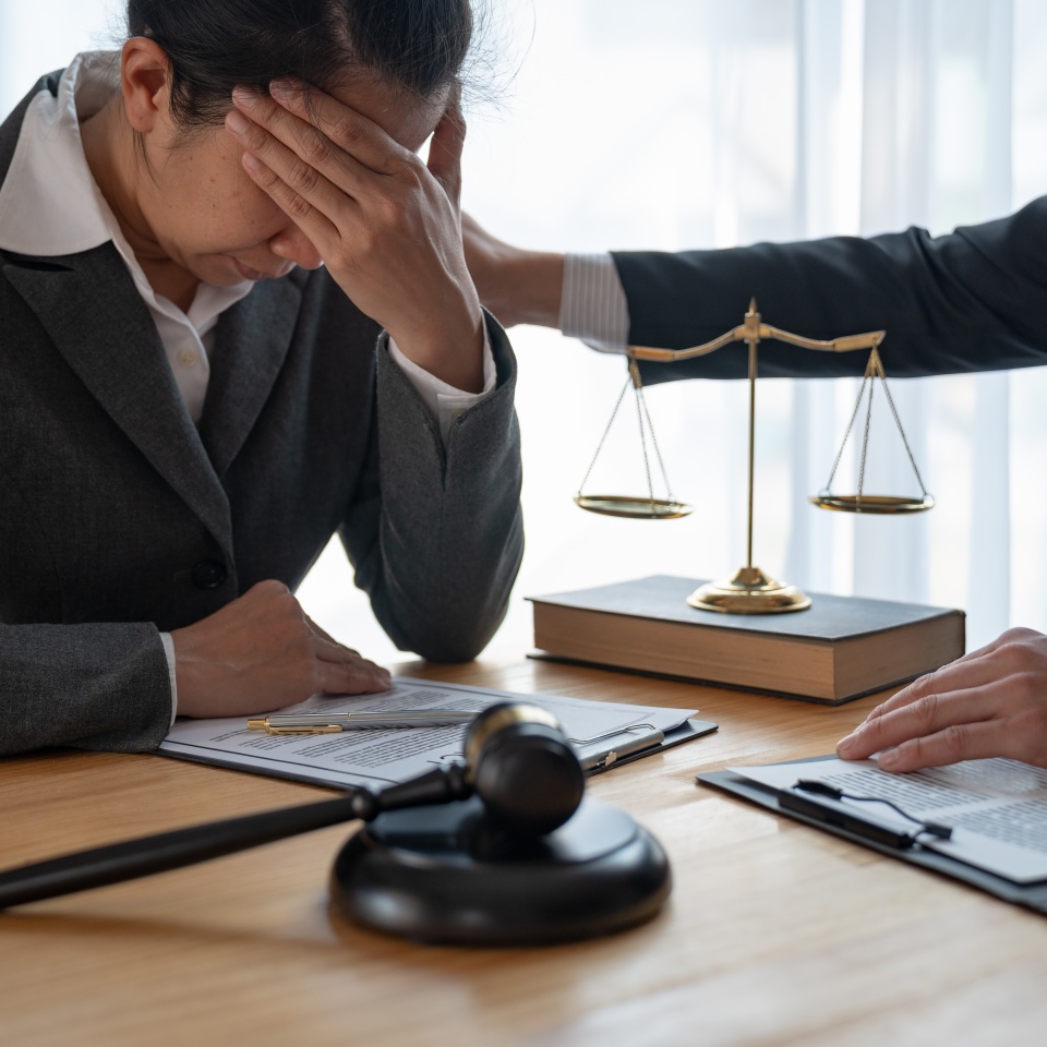 Asian Businessman Lawyers are stressed with their legal work and have a team or client to sit and support, advise and comfort in solving legal problems having a better solution within the office.